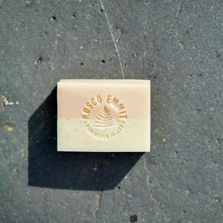 A rectangular bar of cream-colored soap with a double-layered design, embossed with the brand name 'Rosco Emitt' and 'Vancouver, B.C.